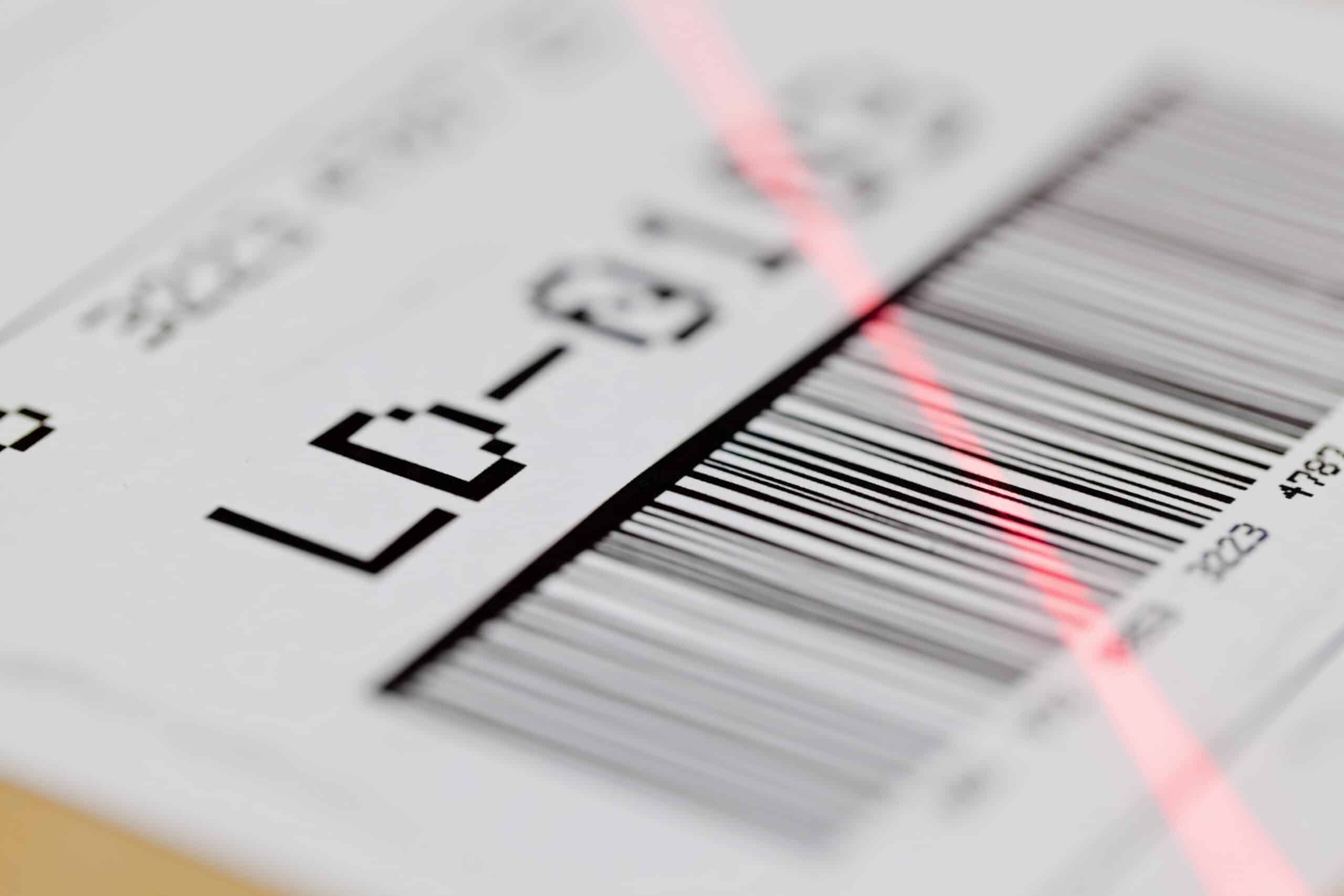 Barcode,On,Shipping,Label,On,Box,Scanned,By,Automatic,Laser